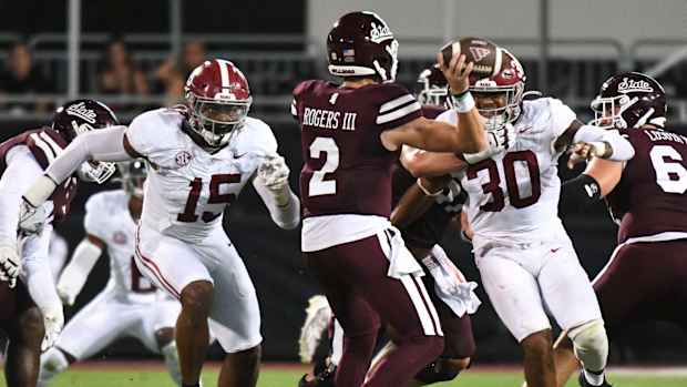 Alabama Crimson Tide linebacker Dallas Turner (15) and Alabama Crimson Tide linebacker Jihaad Campbell (30) put pressure on Mississippi State Bulldogs quarterback Will Rogers (2) in Davis Wade Stadium.